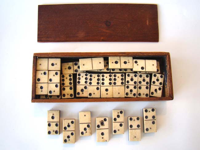 A complete set of Civil War era (circa 1865) bone and ebony dominoes. — image 2